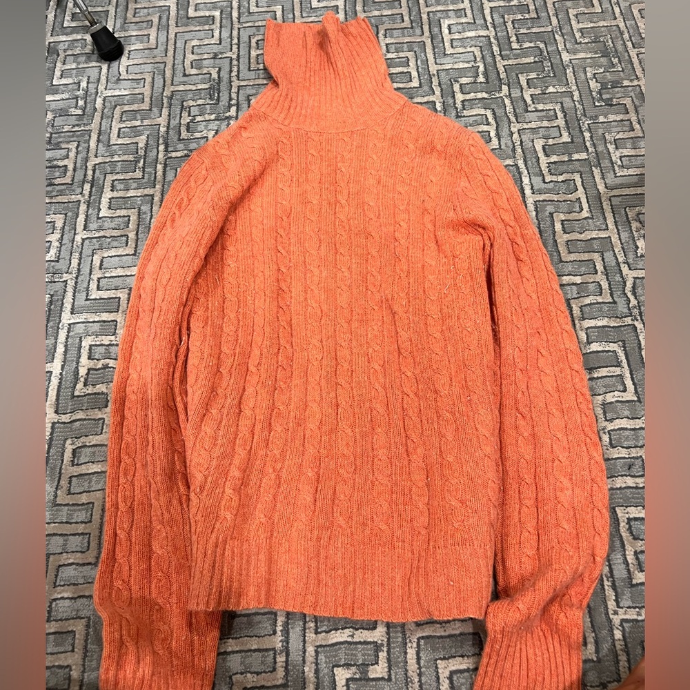 Orange knit turtle neck